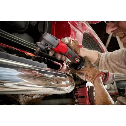 Using 16 Gauge Speed Nibbler For M12 FUEL 12V Cordless Metal Cutter With Starter Kit on vehicle metal sheet.