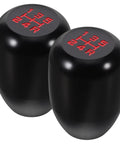 Upgrade Your Ride With This Sleek Kisa Angel 2 Piece Weighted Shift Knob Set For Manual Cars Featuring Ergonomic Grip, Anodized Finish, And Universal 8 10 12 Mm Adapter Kit For Smooth Gearing Action. Black aluminum weighted shift knobs with 5-speed pattern