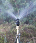 Rotary Oscillating Irrigation Sprinkler Nozzle For Farm Crops Adjustable Spray Radius 6 To 9 Meters in operation on field