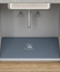 Silicone 28x22 Inch Under Sink Tray, Waterproof Flexible Cabinet Liner for kitchen bathroom and laundry shown under sink with drip