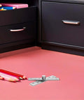6 Pack Invisible Pivot Hinges With 360 Degree Rotation on pink surface, near colored pencils and black cabinet