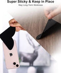 16 Pack Rug Corner Grippers for Hardwood Floors, showing black gripper with phone sticking demonstration on wood surface.