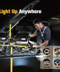 Mechanic using Hella Bright 20000 Lumen Dual Head LED Work Light With Stand 180W IP65 Waterproof Metal Telescoping Tripod on car engine