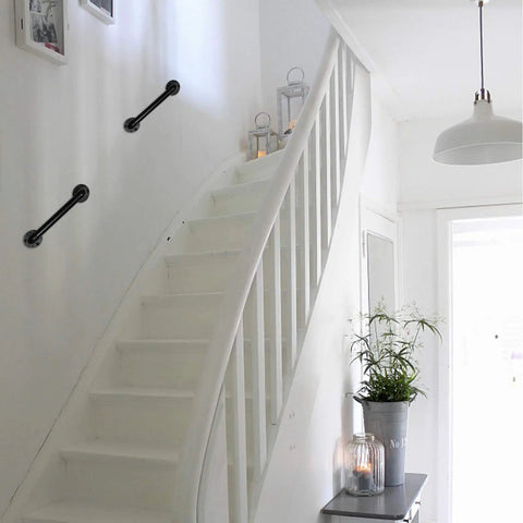 Industrial Pipe Door Pull Handle 12 Inch Black Rustic Grab Bar mounted on white staircase wall.