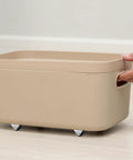 8 Pack Mini Casters 1/2 Inch Low Profile Fixed Caster Wheels With Screws in use on a beige storage box