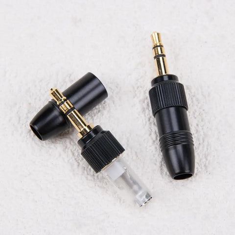 Two Pack Gold Plated DIY 3.5mm Stereo Jack Plug Adapter With M6 Threaded Lock for Headphones and Audio Converters on white surface