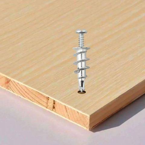 Tool Free Self Drilling Drywall Anchors Kit 100 Pcs Zinc Hollow Wall Anchors with Screws shown on wooden board