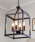 Industrial Pendant Light With Classic Black Metal Cage For Farmhouse And Modern Homes in dining room setting