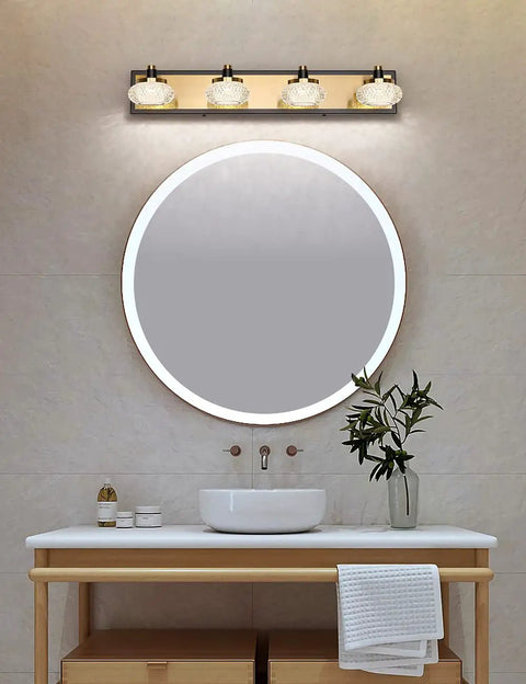 Sleek 4 Light Dimmable Bathroom Vanity Light Fixture Over Mirror, Modern LED Acrylic Wall Lights In Black And Gold, 26 Inch Long, 4000K Neutral White, 20W, 110V AC over a round mirror above a sink.