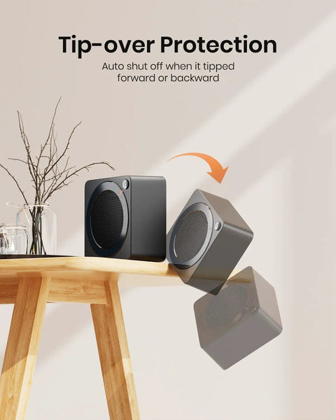 Mini Space Heater For Home And Office Indoor Use Takes The Chill Off Fast PTC Ceramic 500W Energy Efficient Compact Desk Heater demonstrating 45-degree tip-over protection on a table
