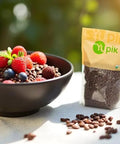 Bowl of yogurt with mixed berries and Organic Raw Cacao Nibs Pack Of Six 2.2 Lb Each Gluten Free Kosher Non GMO Vegan on table
