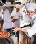 Chef using 9 Inch Round Perforated Aluminum Pizza Peel With Detachable 40 Inch Handle Lightweight Yet Durable Pizza Turner in kitchen