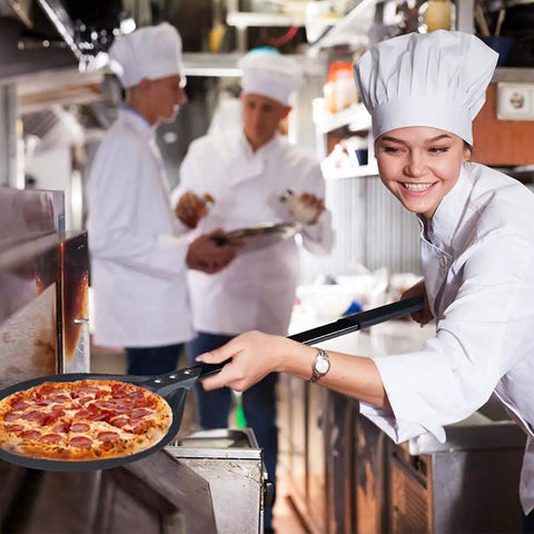 Chef using 9 Inch Round Perforated Aluminum Pizza Peel With Detachable 40 Inch Handle Lightweight Yet Durable Pizza Turner in kitchen