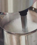 Stainless Steel Espresso And Coffee Maker Duo Brew Kit milk frothing close-up with die-cast aluminum filter holder