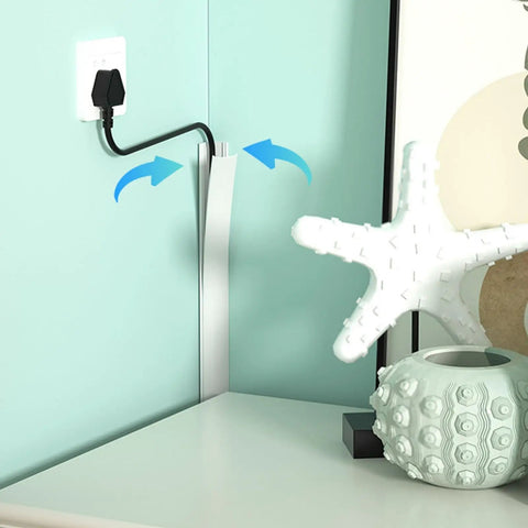 Game Changer Self Adhesive Cable Hider For Zero Mess Walls Smooth PVC Cord Cover installed at a wall corner holding wires.