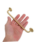 Hand holding Brushed Brass Cabinet Handles Set Of 2 Solid Brass Drawer Pulls With Base 160mm Hole Spacing Sleek Modern Cupboard Door Pull