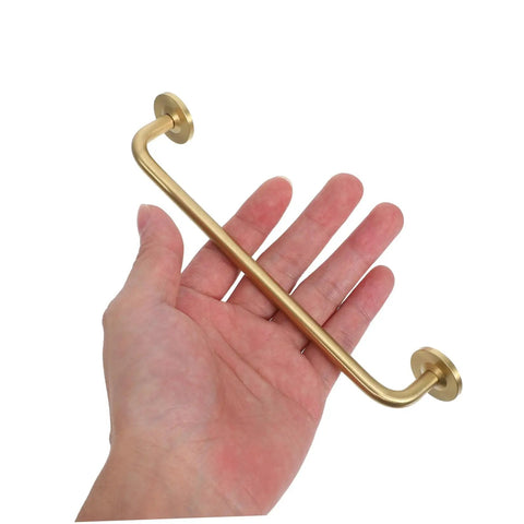 Hand holding Brushed Brass Cabinet Handles Set Of 2 Solid Brass Drawer Pulls With Base 160mm Hole Spacing Sleek Modern Cupboard Door Pull
