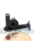 Close-up of Beefy Five Eighths Inch Flat Head Socket Cap Screws Six Forty UNF Alloy Steel Black Oxide Hex Drive