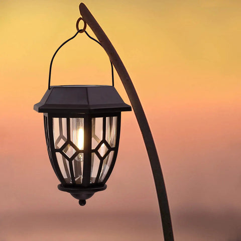 Dope Hexagon Solar Lanterns Outdoor Waterproof Hanging Lights with warm LED filament bulb against a sunset.