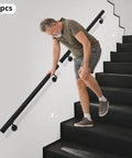 Upgrade Your Stairs With This Rock Solid Stainless Steel Wall Mount Handrail. Man using black flush mount handrail on stairs.