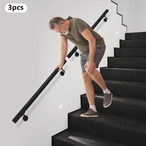 Upgrade Your Stairs With This Rock Solid Stainless Steel Wall Mount Handrail. Man using black flush mount handrail on stairs.