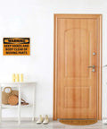 Warning Keep Hands And Body Clear Of Moving Parts Tin Sign on wall above wooden door in home entryway