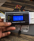 Your Go-To 8-In-1 Power Supply Tester For PC Builds With ATX 20-24 Pin, IDE HDD SATA, PCIe 6-Pin, EPS 8-Pin, Floppy 4-Pin, in use.