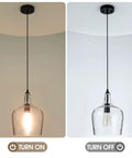 Modern Glass Pendant Light In Black One Light Dome Fixture For Kitchen Island And Dining Hallway, illuminated and unlit view
