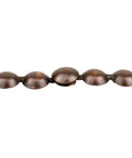 Premium Antique Copper Upholstery Tacks Killer Nailhead Trim showing 7/16 inch heads connected in a strip for furniture reupholstering.