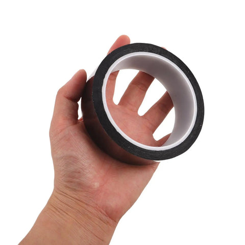 Hand holding a roll of Anti Static Adhesive Tape For Electronics Assembly And PCB Work, Heat Resistant Pro Grade Adhesion, Thin And Easy To Cut, Great For Circuit Boards, Electronics Parts, Floor Labeling And Industrial Use