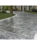 Kickass High Gloss Concrete And Masonry Sealer offering a bold wet look finish on a stamped concrete driveway.