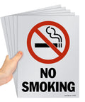 Pack Of Five Beefy 12 X 9 Inch No Smoking Signs bold warning icon held in hand, screen printed on sturdy 10 mil polystyrene.