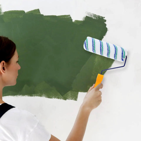 Woman using a Two Piece Seamless Corner Paint Roller With Dual Grip Handles for crisp wall edges while painting.
