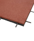 Close-up of interlocked outdoor rubber tiles, showing 1-inch thickness and interlocking design for playground and backyard gym flooring.