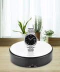F&Y 360 Degree Electric Rotating Mirror Display Stand With Flexible Speed Turntable For Jewelry Product Photography showcasing a watch