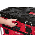 Hand holding handle of Packout 22 Inch Tool Box With Heavy Duty Latches And Interior Organizer Trays Durable Modular Storage System
