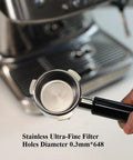 Portafilter, 54mm stainless steel with double spout and black ABS handle; 0.3mm ultra-fine filter holes, shown near espresso machine.