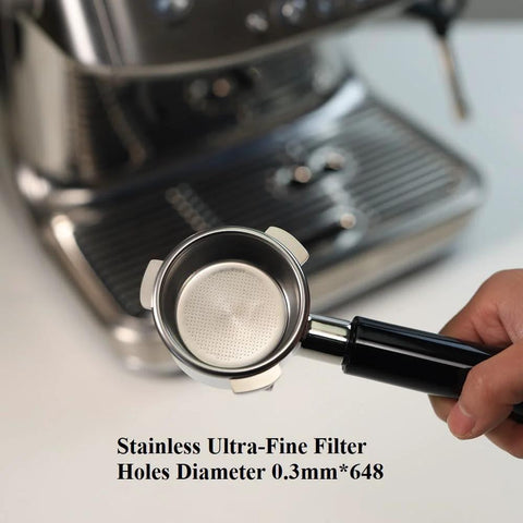 Portafilter, 54mm stainless steel with double spout and black ABS handle; 0.3mm ultra-fine filter holes, shown near espresso machine.