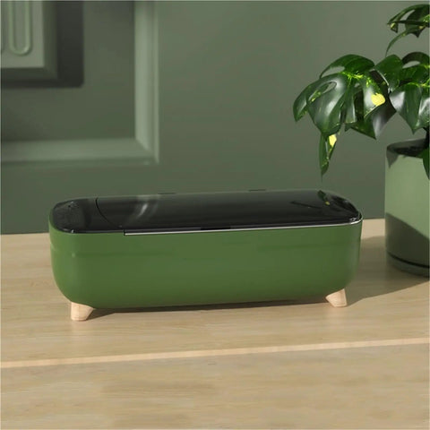 Compact 40khz Ultrasonic Cleaner For Jewelry And Personal Care Devices Straight Up Deep Cleansing Machine with green body and black lid.