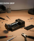 This Mini Aluminum Alloy Bench Vise Is A Compact Clamp Perfect For Jewelry Making And Precision Crafts on a workspace.