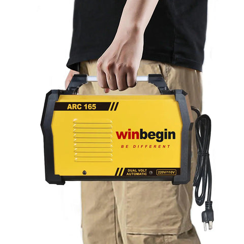 Person holding Dual Voltage Arc Welding Machine 100V To 240V With Digital Display 165A Max Heavy Duty Stick Welder