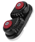 Close-up cam cleat rope clutch, aluminum body with dual red screw caps, black finish