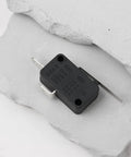 Must Have 2 Pin Micro Limit Switch With Lever VMN15 125V 250V AC on stone surface