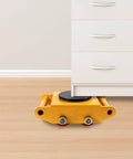 Heavy Duty Machinery Mover Skate Dolly With Four Smooth Rolling Wheels, Move Heavy Freight Without Breaking A Sweat, 13228 Lb Capacity shifting a cabinet on a wood floor.