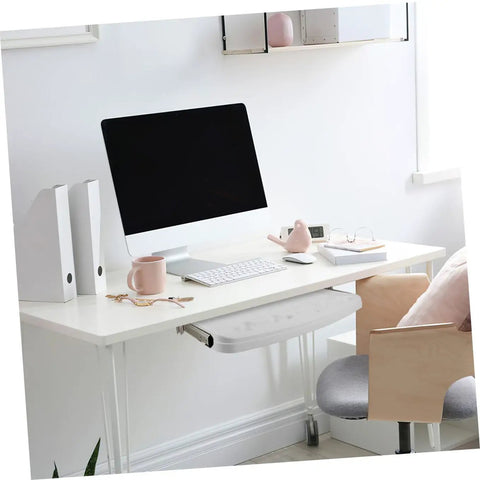 Heavy Duty Sliding Keyboard Tray Smooth Glide Under Desk Mount seen in a modern home office setup with an iMac and accessories.