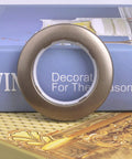 Single brown grommet from 20 Pack Curtain Grommet Kit with 1.7 Inch Inner Diameter Silencer Sliding Brown ABS Grommets for Fabric Fasteners