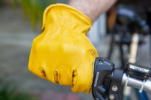 Heavy Duty Leather Work Gloves for Men and Women, Yellow X Large 3 Pack, gripping a bicycle handle, premium cowhide