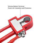 Silicone battery terminal cover on red car battery clamp with insulated cable and bolt connection