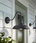 14 Inch Outdoor Gooseneck Barn Light Fixture Two Pack Black Matte Exterior Wall Sconce mounted on a patio wall