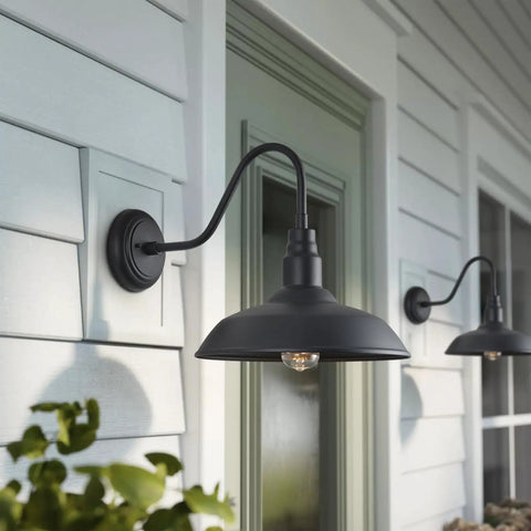 14 Inch Outdoor Gooseneck Barn Light Fixture Two Pack Black Matte Exterior Wall Sconce mounted on a patio wall